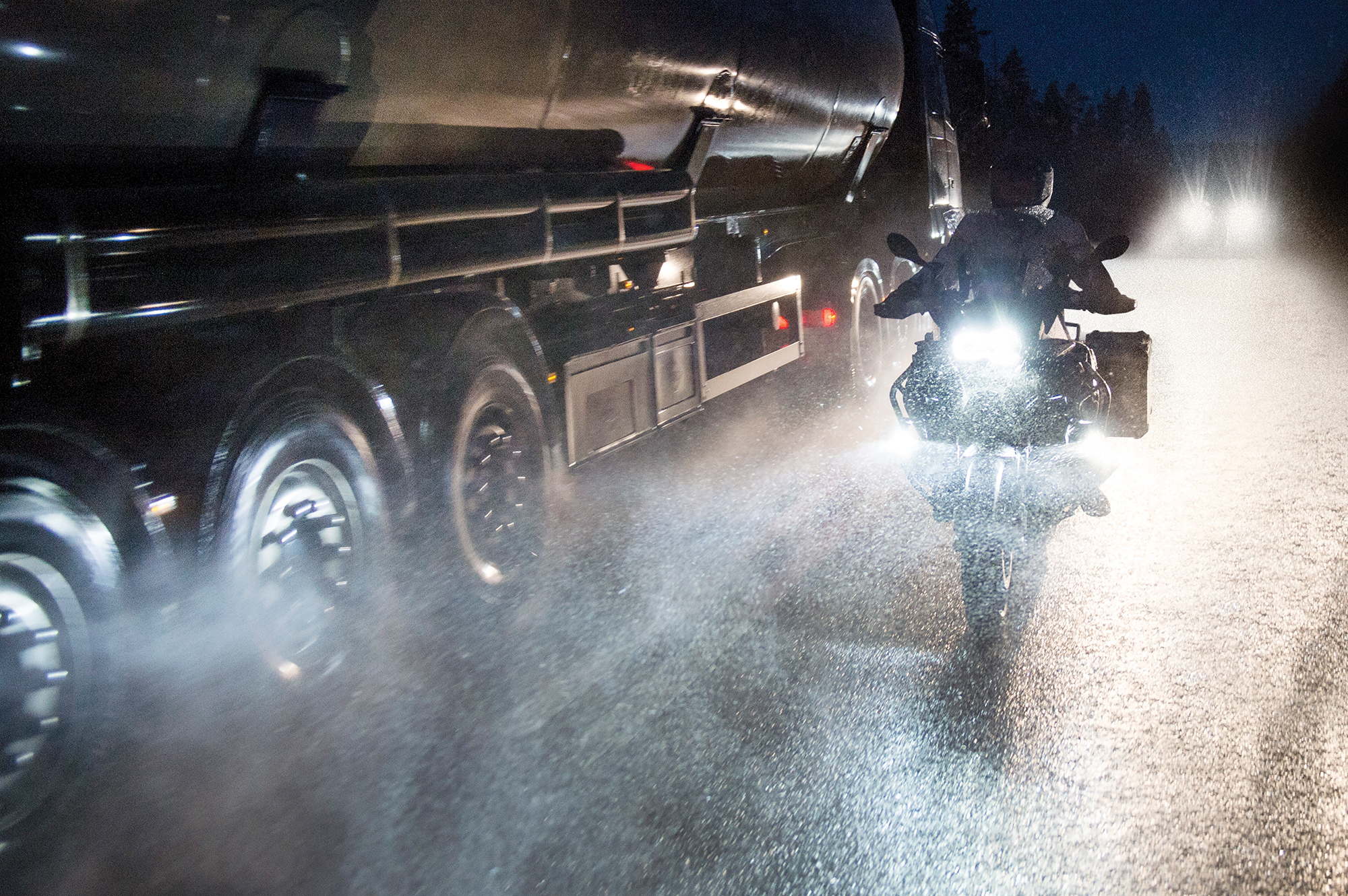 Rider with laminated motorcycle jacket in adverse conditions
